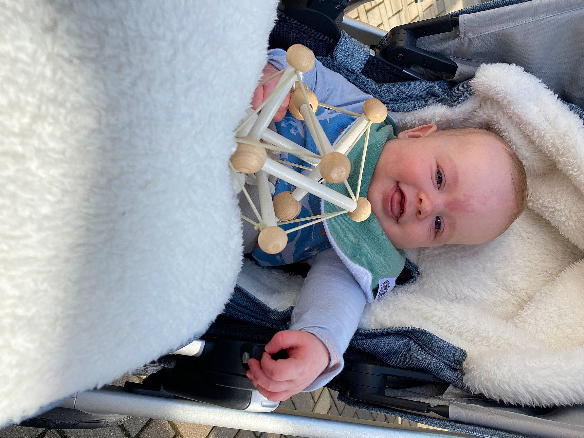 Bobby is registered to the contest to win money with this photo: baby, baby_carriage, baby_products, baby_safety, baby_toddler_clothing, child, comfort, event, freezing, hat, health_care, linens, person, skin, snow, textile, toddler, winter