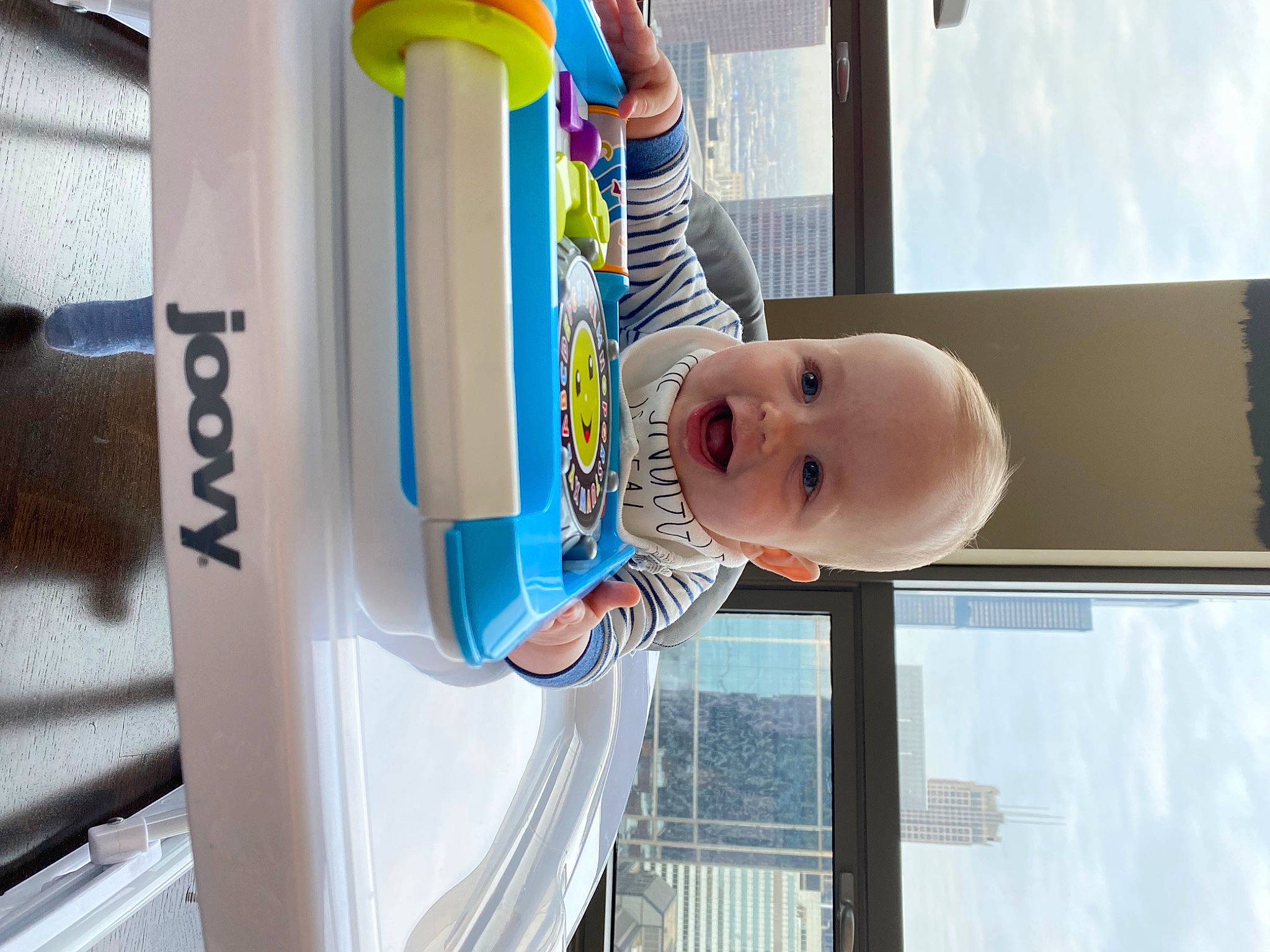 Bobby is registered to the contest to win money with this photo: baby, baby_products, baby_safety, baby_toddler_clothing, child, electric_blue, fun, happy, hat, leisure, machine, person, plastic, product, recreation, room, smile, t_shirt, toddler, vacation
