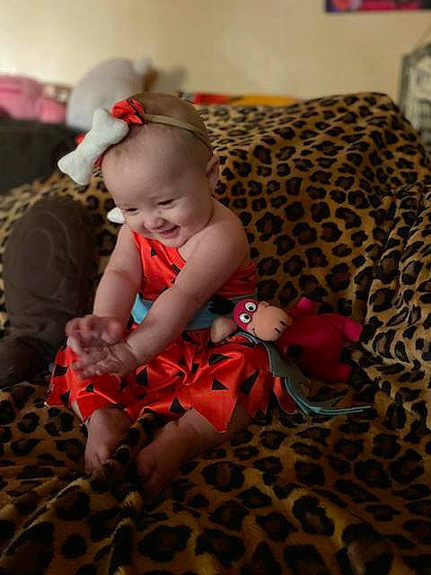 Satori joined the competition — help win amazing prizes! baby, baby_toddler_clothing, carmine, child, comfort, couch, flooring, fun, human_leg, joy, lap, leg, linens, pattern, person, pink, room, sitting, skin, sock