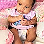 Alivia is registered to the contest to win money with this photo: baby, blanket, child, clothing, cozy, curly_hair, cute, diaper, feet, floral, hands, indoor, infant, person, pillow, pink, portrait, resting, soft_lighting, young