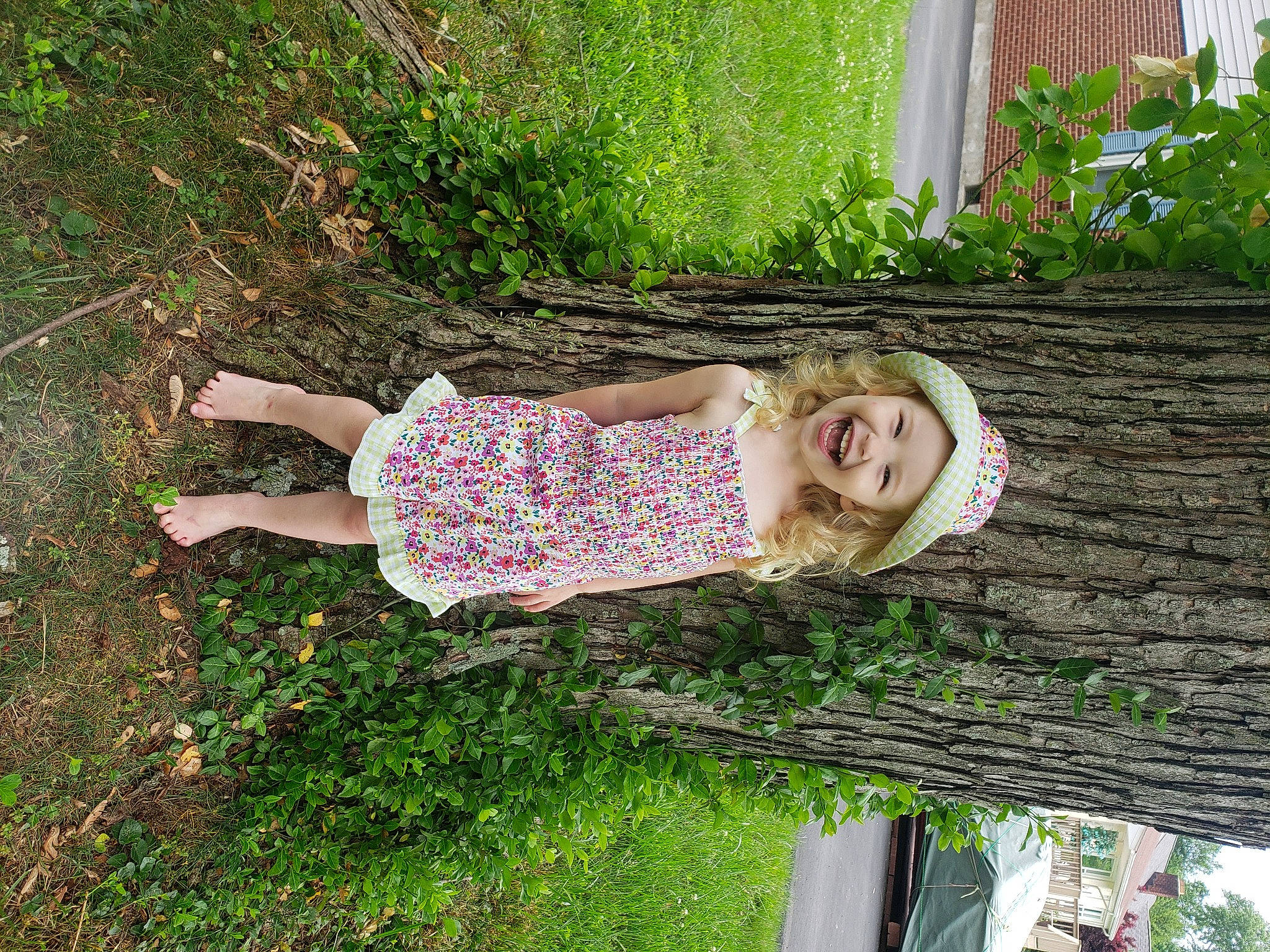 Ellie Mae joined the competition — help win amazing prizes! baby_toddler_clothing, botany, fun, garden, grass, grass_family, groundcover, happy, headwear, leisure, magenta, people_in_nature, person, pink, plant, shrub, sitting, smile, spring, summer