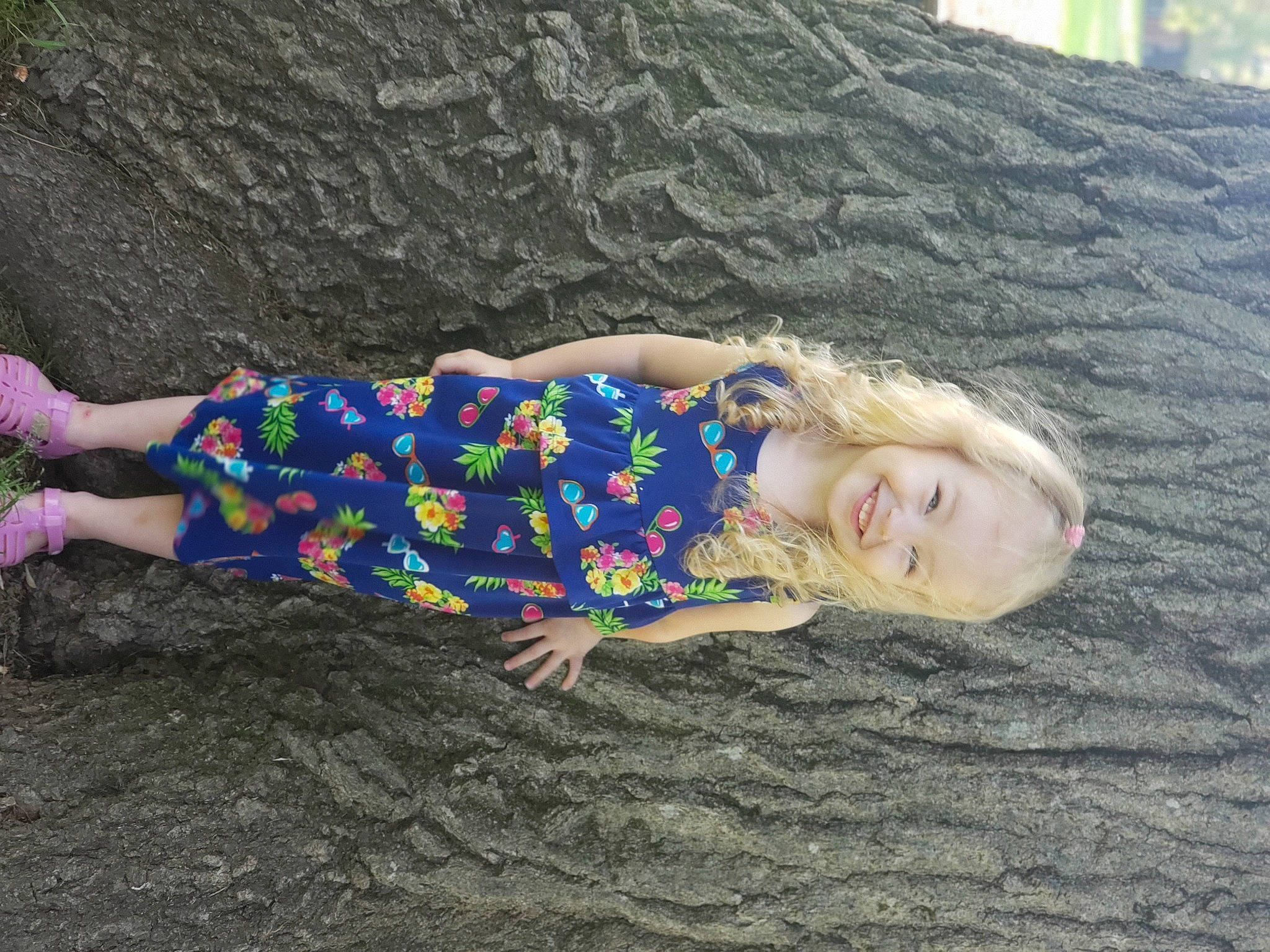 Ellie Mae is registered to the contest to win money with this photo: child, fun, grass, grey, human_leg, joy, landscape, leisure, pattern, people_in_nature, person, plant, recreation, rock, sand, smile, soil, thigh, toddler, tree