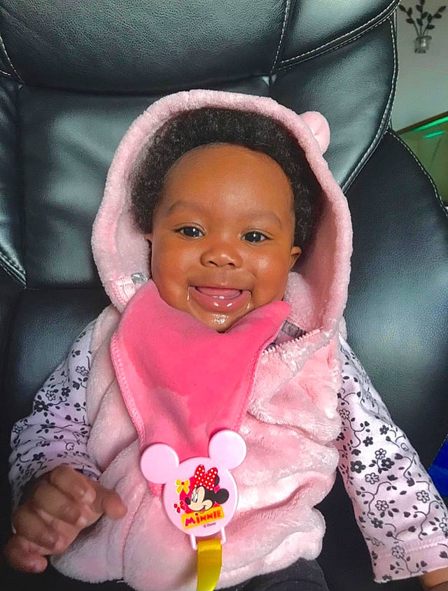 Kailee joined the competition — help win amazing prizes! baby, baby_toddler_clothing, child, finger, fun, gesture, green, hand, happy, joy, lip, magenta, mouth, nose, organ, person, pink, purple, skin, smile