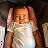 Priyah joined the competition — help win amazing prizes! baby, infant, car_seat, onesie, child, cute, expression, cheeks, soft, cushion, clothing, indoor, portrait, person, seat, safety, warning_label, skin, head, hand