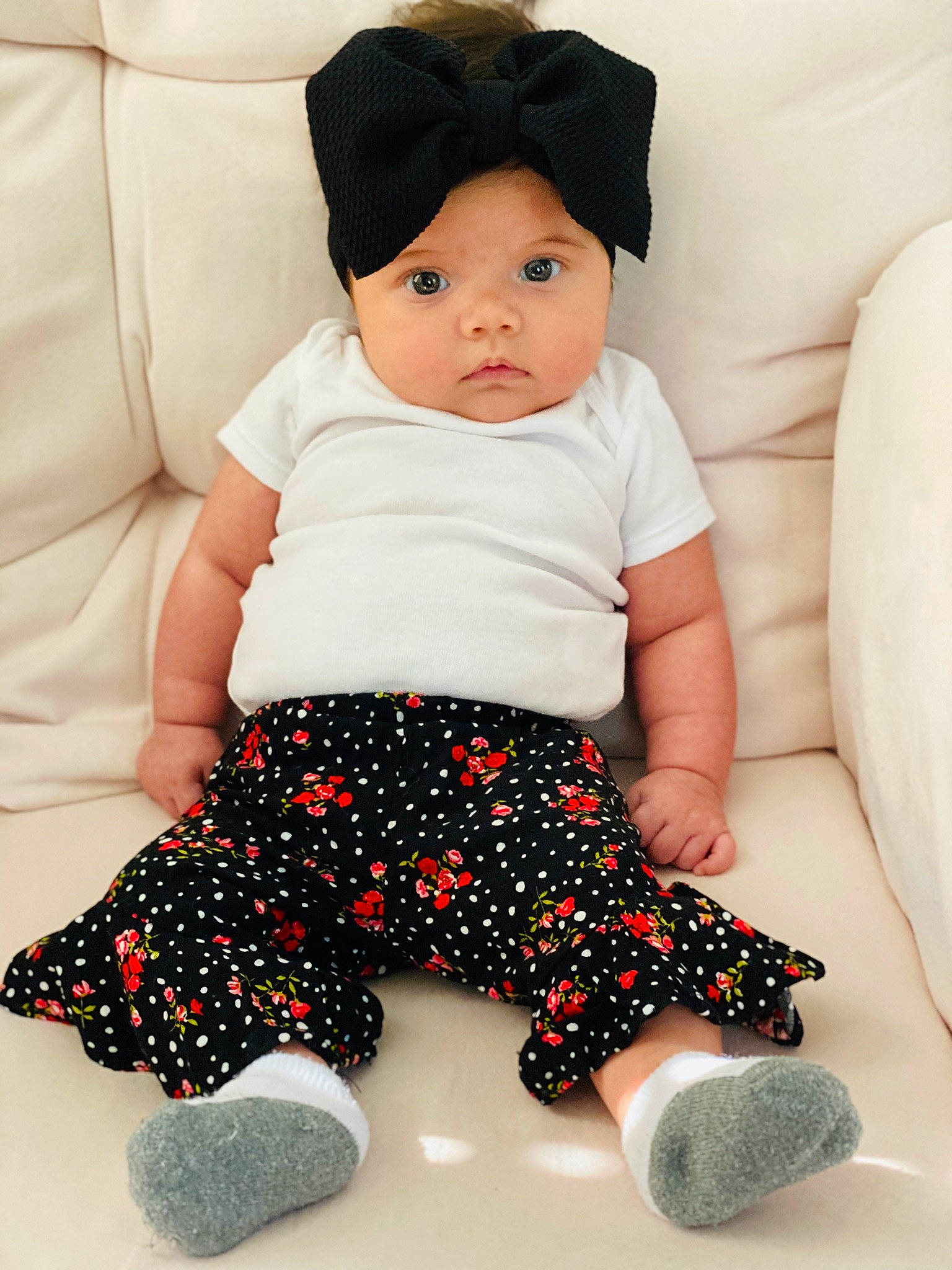 Annabel is registered to the contest to win money with this photo: baby, baby_bloomers, baby_toddler_clothing, black, black_hair, child, headgear, headwear, pattern, person, skin, sleeve, toddler, toy