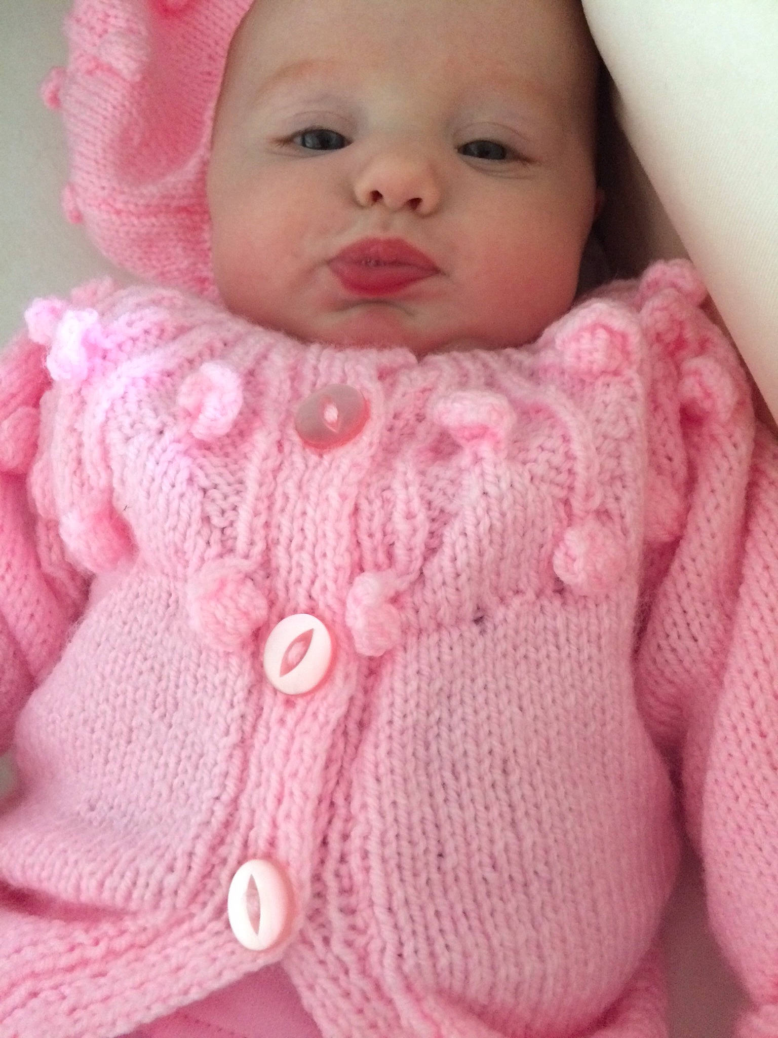 Ava-leigh is registered to the contest to win money with this photo: art, baby, cheek, child, crochet, face, head, knitting, lip, nose, outerwear, person, pink, skin, sleeve, sweater, textile, toddler, wool, woolen