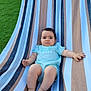 Léo a rejoint le concours — aidez-le/la à gagner de superbes lots ! baby, hammock, striped, outdoor, grass, dog, lawn, child, blue_clothing, person, relaxing, feet, face, summer, backyard, furniture, pet, animal, leg, expression