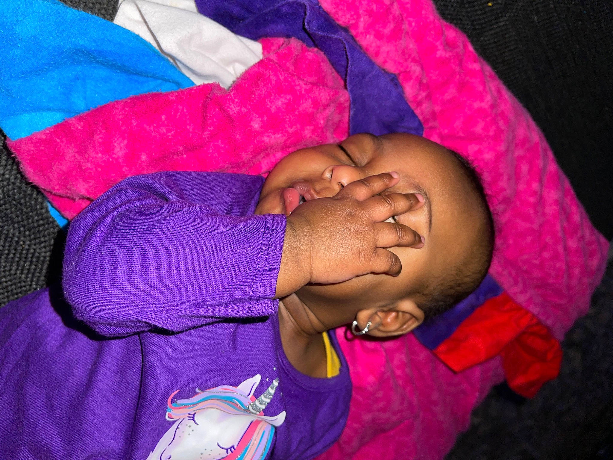 Alani is registered to the contest to win money with this photo: abdomen, baby, child, comfort, elbow, electric_blue, gesture, hand, happy, human_body, magenta, nail, person, pink, purple, sleeve, t_shirt, thumb, trunk, violet