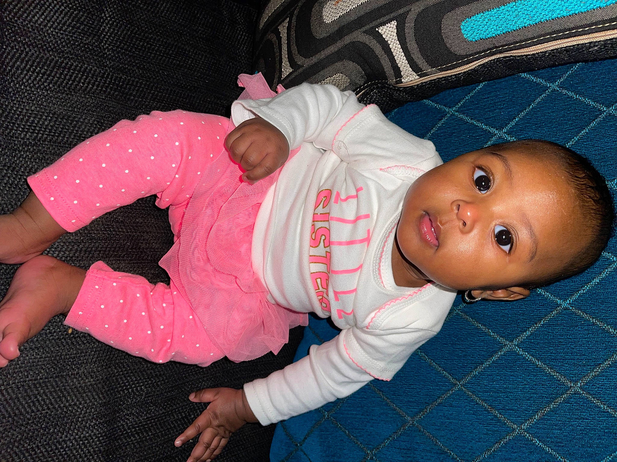 Alani is registered to the contest to win money with this photo: baby, baby_products, baby_toddler_clothing, carmine, cheek, child, comfort, electric_blue, pattern, person, sleeve, toddler