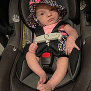 Wynter joined the competition — help win amazing prizes! baby, baby_accessory, car_safety, car_seat, child, cute, face, hat, headwear, indoor, infant, looking, newborn, padded_seat, person, pink_clothing, seatbelt, secure, sitting, straps