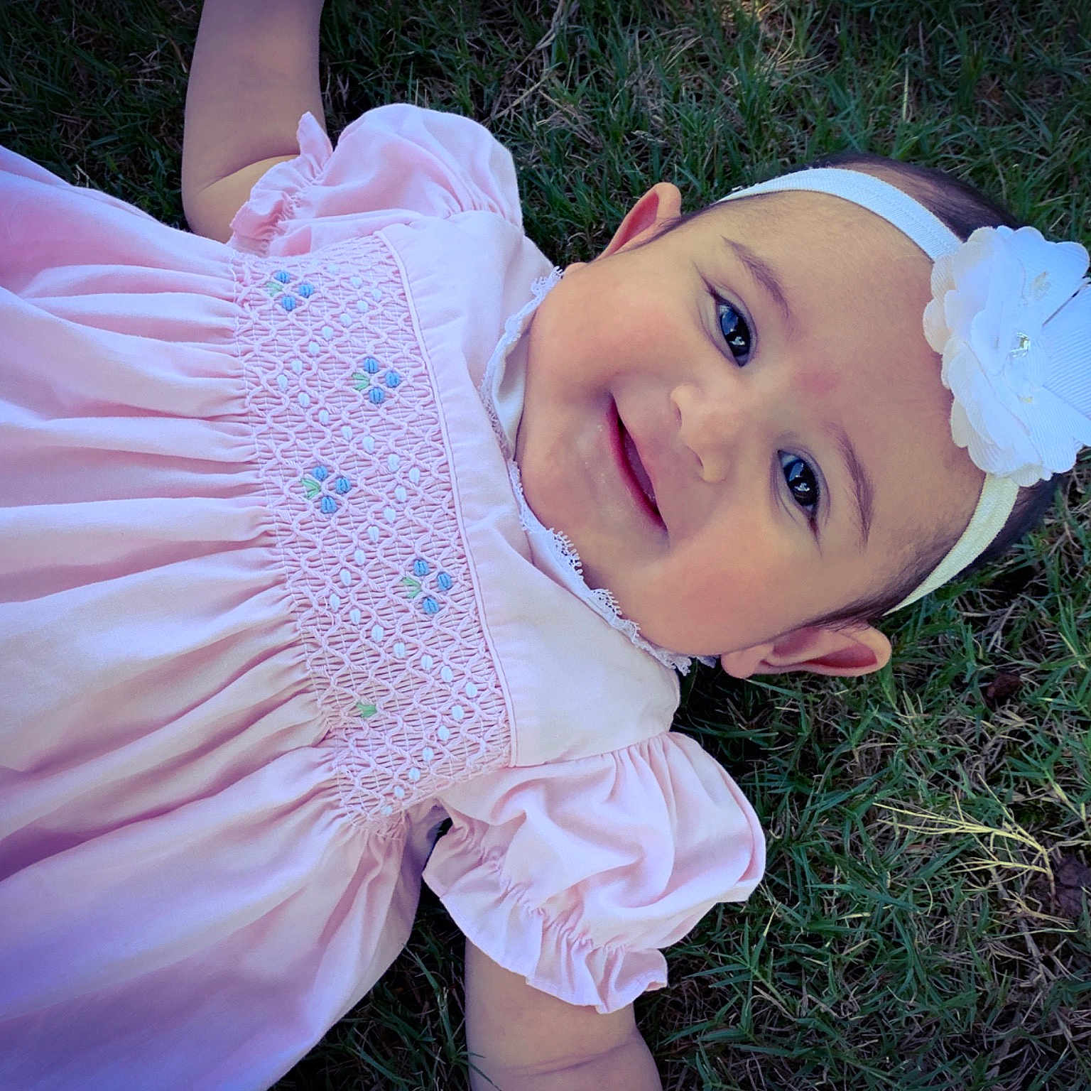 Kathryn is registered to the contest to win money with this photo: baby, child, costume, eye, fashion_accessory, grass, hair_accessory, happy, head, headgear, pink, plant, skin, smile, toddler