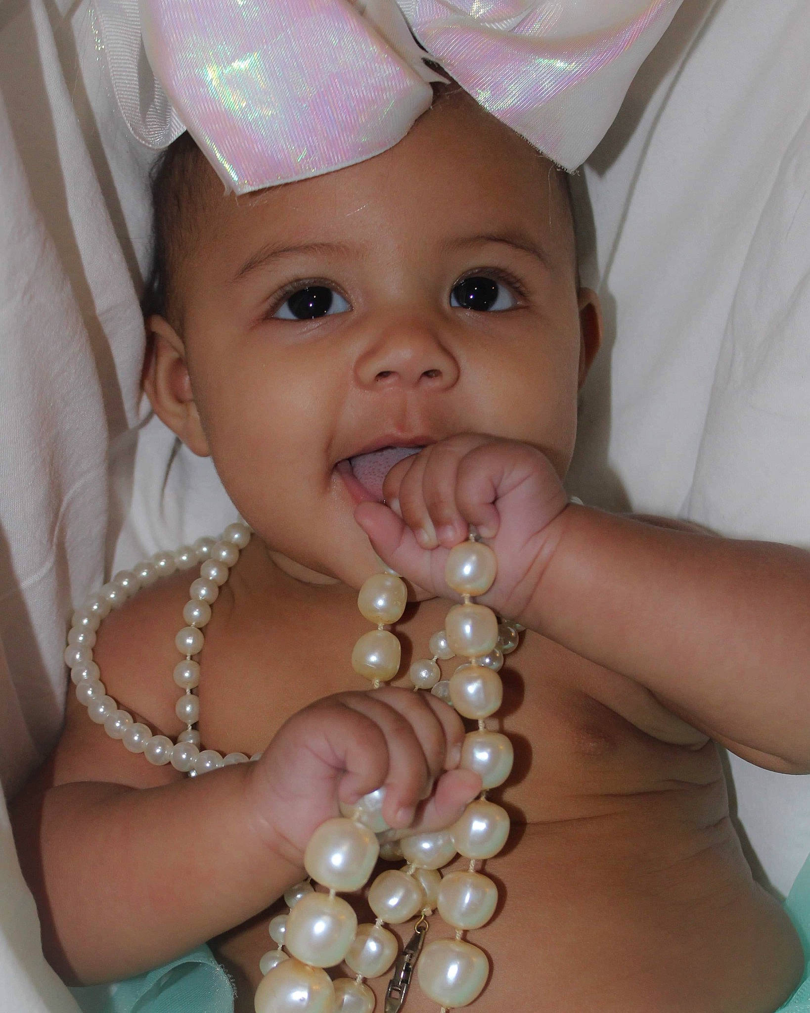 Peyton joined the competition — help win amazing prizes! baby, child, face, fashion_accessory, jewellery, pearl, person, skin, smile, toddler