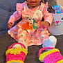 Alisha joined the competition — help win amazing prizes! baby, basket, carrot_pattern, child, couch, cute, easter_basket, fuzzy_slippers, girl, hair, happy, indoors, jewelry, necklace, person, pink_dress, sitting, slippers, smiling, snack
