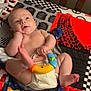 Brayden joined the competition — help win amazing prizes! baby, infant, diaper, toy, colorful_blanket, patterned_blanket, tire_pattern, space_pattern, foot, hand, face, curious, lying_down, indoors, child, playful, cute, soft_skin, young, crawling_age