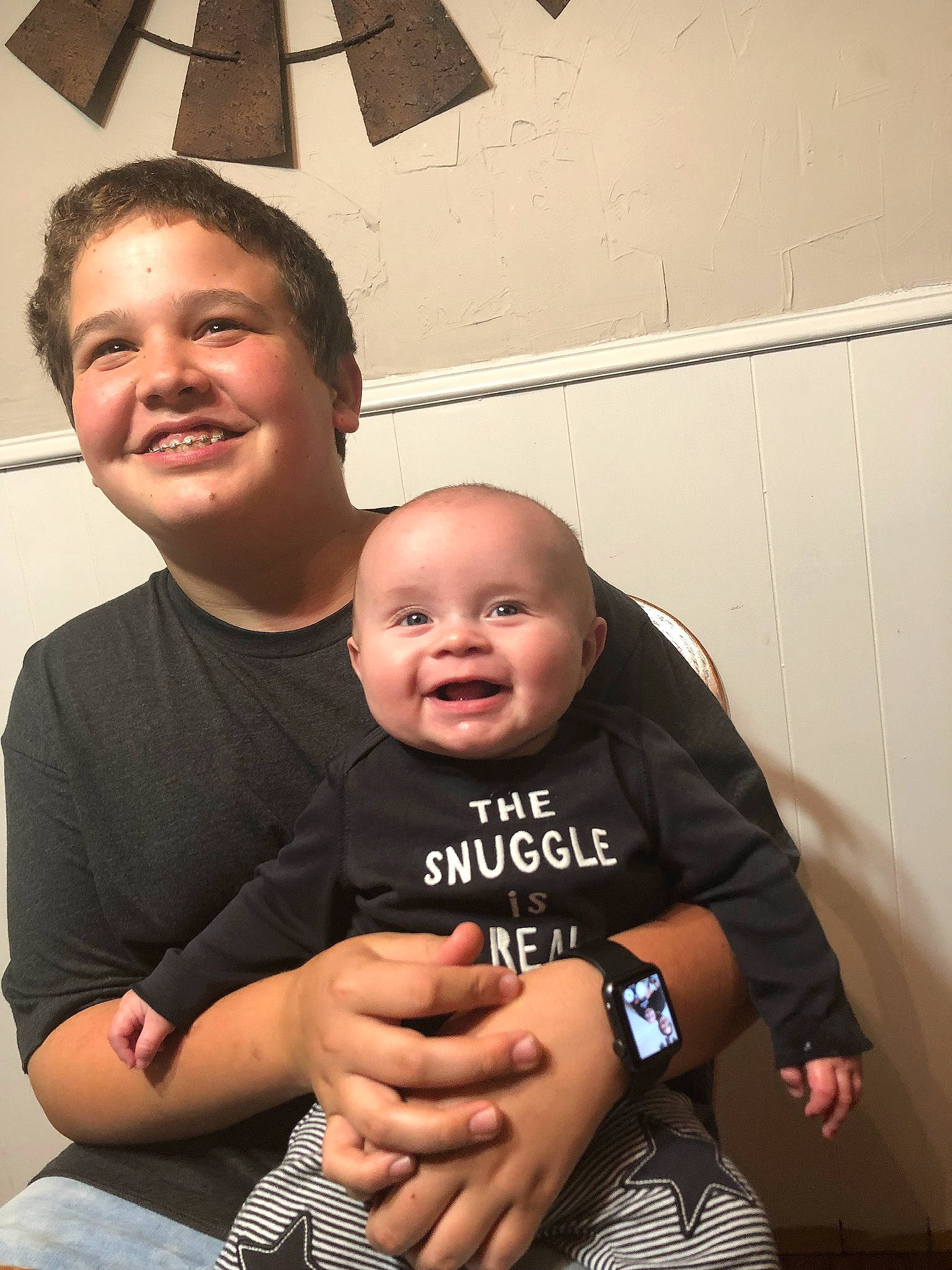 Deegan is registered to the contest to win money with this photo: arm, child, facial_expression, father, fathers_day, fun, happy, joy, male, muscle, people, person, smile, toddler