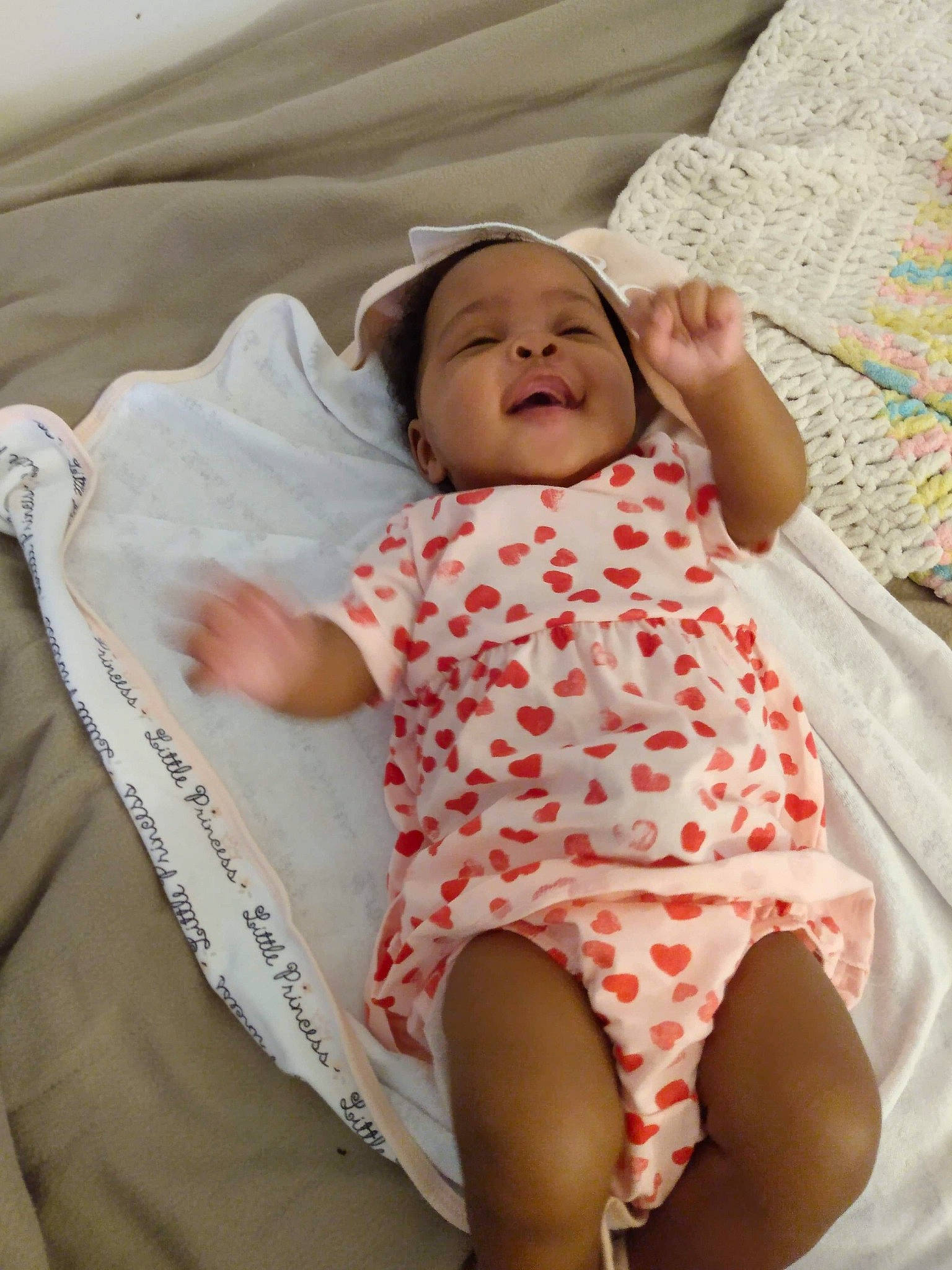 Harmony is registered to the contest to win money with this photo: baby, baby_products, baby_safety, baby_sleeping, baby_toddler_clothing, bed, bedding, child, comfort, happy, head, headwear, linens, mammal, pattern, person, pink, product, skin, sleeve