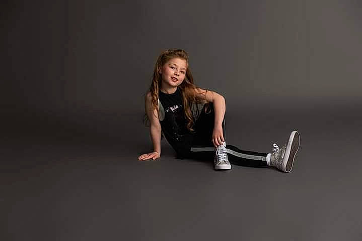 Baylee joined the competition — help win amazing prizes! audio_equipment, automotive_design, balance, boot, darkness, elbow, event, flash_photography, flooring, foot, fun, gesture, hair, human_leg, knee, person, shorts, sleeve, sportswear, thigh