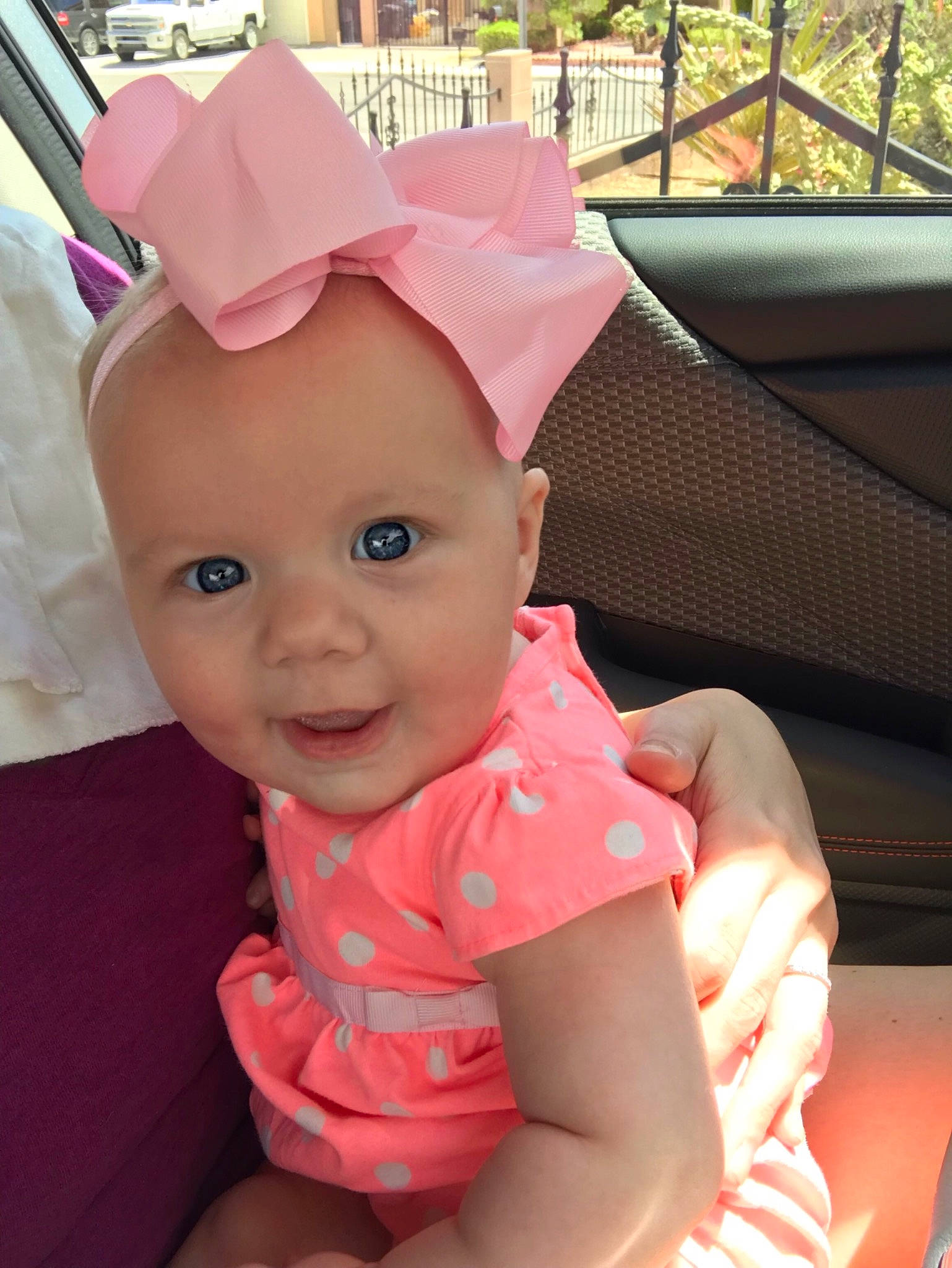 Berklee is registered to the contest to win money with this photo: baby, baby_toddler_clothing, bonnet, child, ear, fashion_accessory, hat, head, headgear, person, pink, skin, sun_hat, toddler