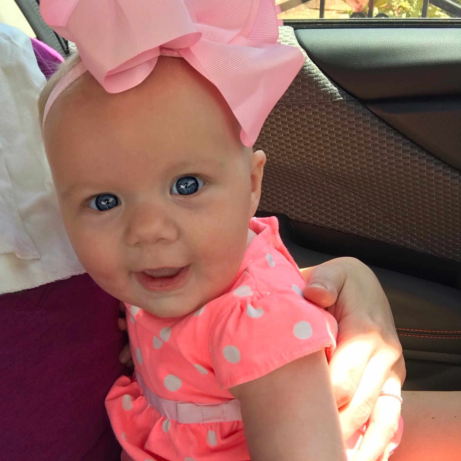 Berklee is registered to the contest to win money with this photo: baby, baby_toddler_clothing, bonnet, child, ear, fashion_accessory, hat, head, headgear, person, pink, skin, sun_hat, toddler
