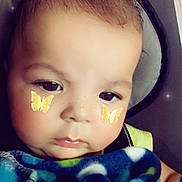 Devon joined the competition — help win amazing prizes! baby, child, face, blanket, closeup, butterfly_sticker, cute, indoors, soft_light, portrait, expression, young_child, skin, head, eyes, person, baby_blanket, infant, nose, cheeks