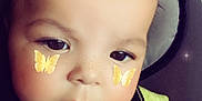 Devon joined the competition — help win amazing prizes! baby, baby_blanket, blanket, butterfly_sticker, cheeks, child, closeup, cute, expression, eyes, face, head, indoors, infant, nose, person, portrait, skin, soft_light, young_child