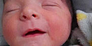 Devon is registered to the contest to win money with this photo: newborn, baby, sleeping, blanket, knit_hat, cozy, infant, closeup, face, wrapped, cute, soft, peaceful, child, portrait, indoors, warm, resting, toddler, smiling