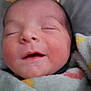 Devon is registered to the contest to win money with this photo: newborn, baby, sleeping, blanket, knit_hat, cozy, infant, closeup, face, wrapped, cute, soft, peaceful, child, portrait, indoors, warm, resting, toddler, smiling