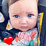 Emma is registered to the contest to win money with this photo: baby, blanket, blue_eyes, brown_hair, car_seat, child, close_up, colorful, cute, floral_clothing, heart_sticker, indoors, infant, pacifier, pink, portrait, safety_harness, sitting, vehicle, wide_eyed