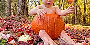 Abel is registered to the contest to win money with this photo: baby, pumpkin, autumn, leaves, forest, sunlight, outdoor, nature, child, fall, grass, trees, seasonal, cute, sitting, barefoot, orange, yellow, playful, leaf