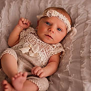 Emma joined the competition — help win amazing prizes! baby, bed, blanket, child, clothing, cute, face, feet, fingers, hands, headband, indoors, infant, lace, newborn, pink, portrait, resting, skin, soft