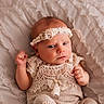 Emma is registered to the contest to win money with this photo: baby, blanket, bow, child, clothing, cozy, cute, eyes, face, hand, headband, infant, lace, lying_down, newborn, portrait, resting, skin, sleepwear, soft_texture