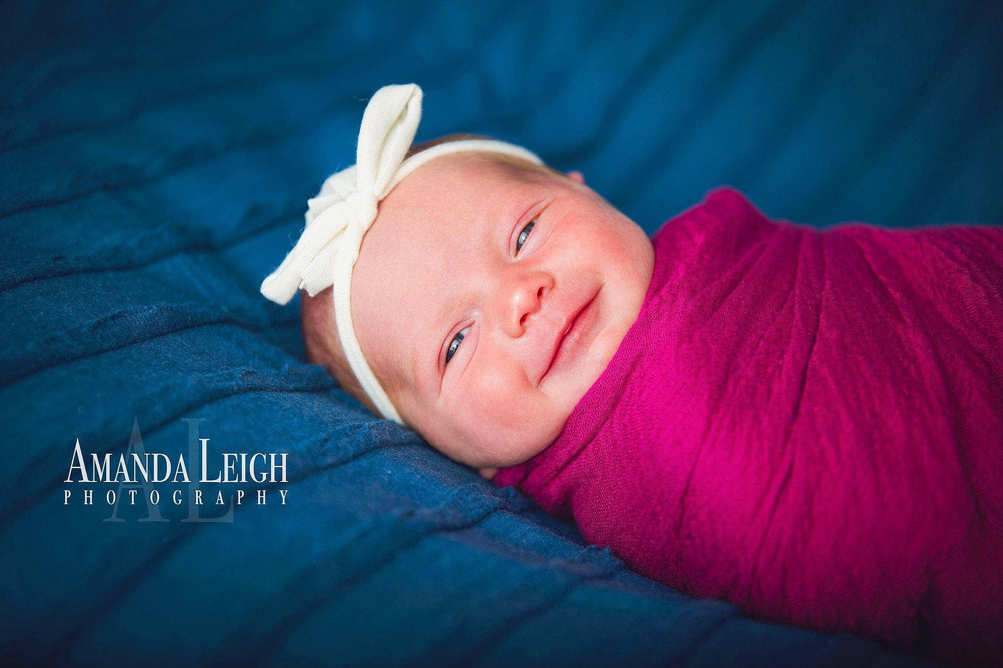 Eliza joined the competition — help win amazing prizes! baby, blue, cheek, child, ear, face, hair_accessory, hand, happy, head, headgear, mouth, person, photograph, photography, pink, portrait, portrait_photography, skin, smile