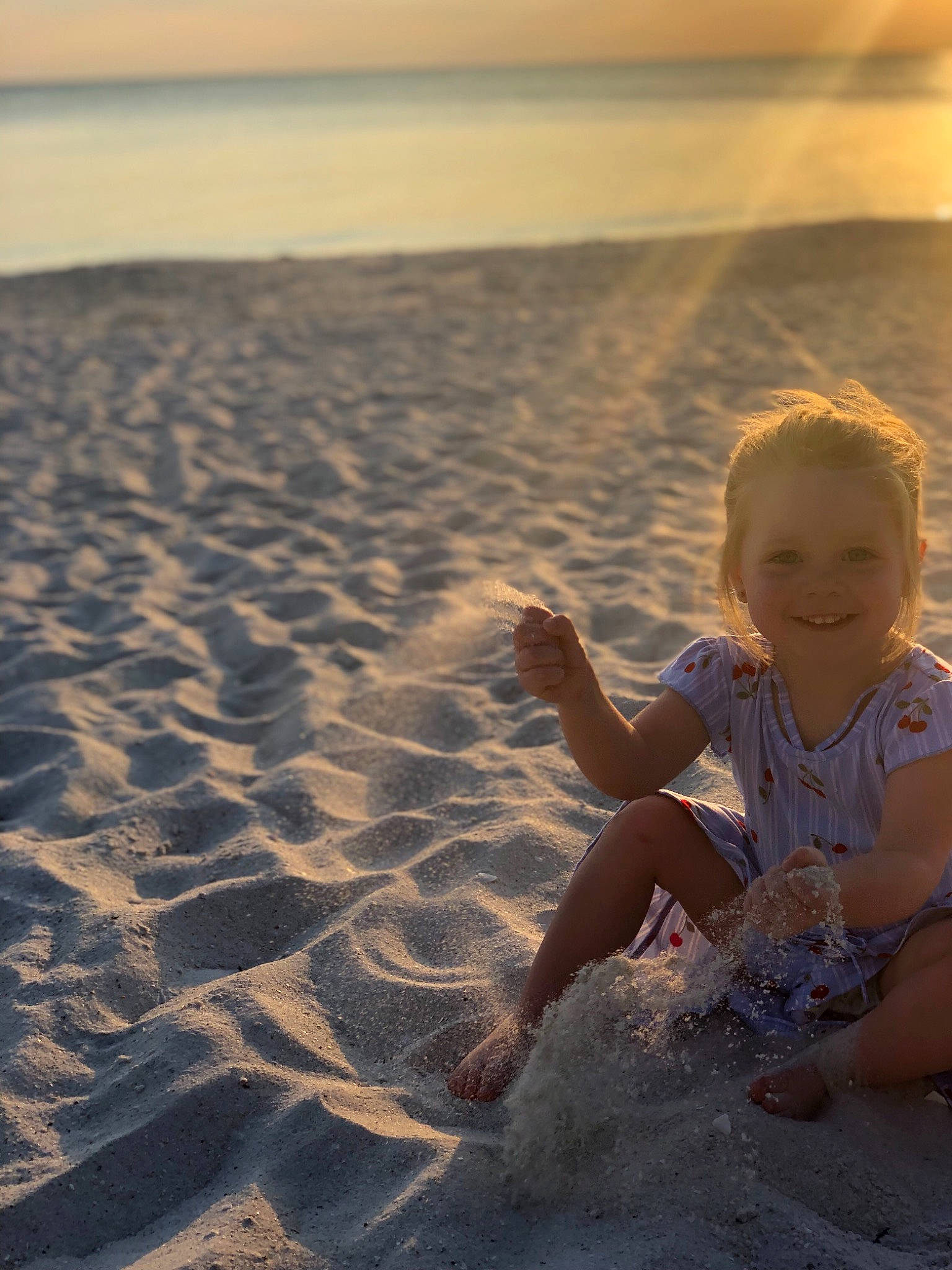 Joslyn is registered to the contest to win money with this photo: barefoot, beach, child, cloud, fun, hand, happy, horizon, joy, landscape, ocean, person, photograph, play, sand, sea, sitting, sky, summer, sunlight