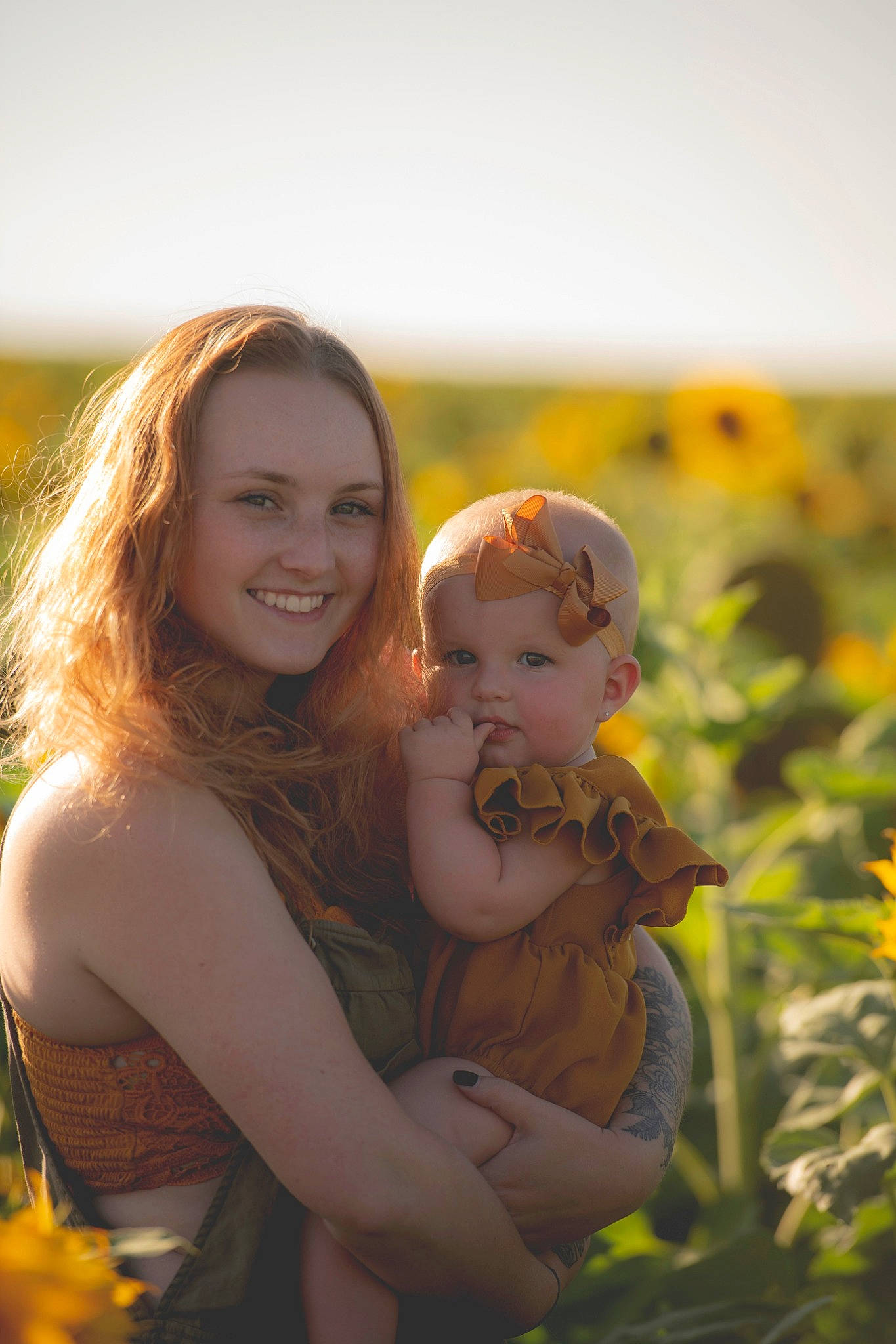 Delilah is registered to the contest to win money with this photo: blond, child, flower, fun, grass, happy, iris, joy, long_hair, love, people_in_nature, person, photograph, photography, plant, portrait, skin, smile, summer, sunlight
