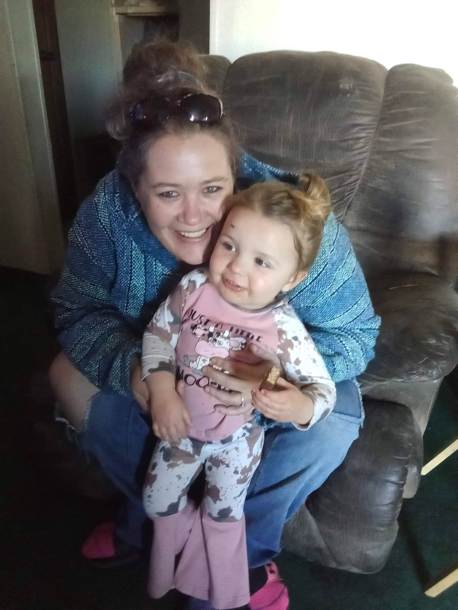 Sophia is registered to the contest to win money with this photo: baby, chair, cheek, child, comfort, couch, event, facial_expression, fun, hair, happy, iris, joy, lap, leg, person, room, sitting, skin, smile