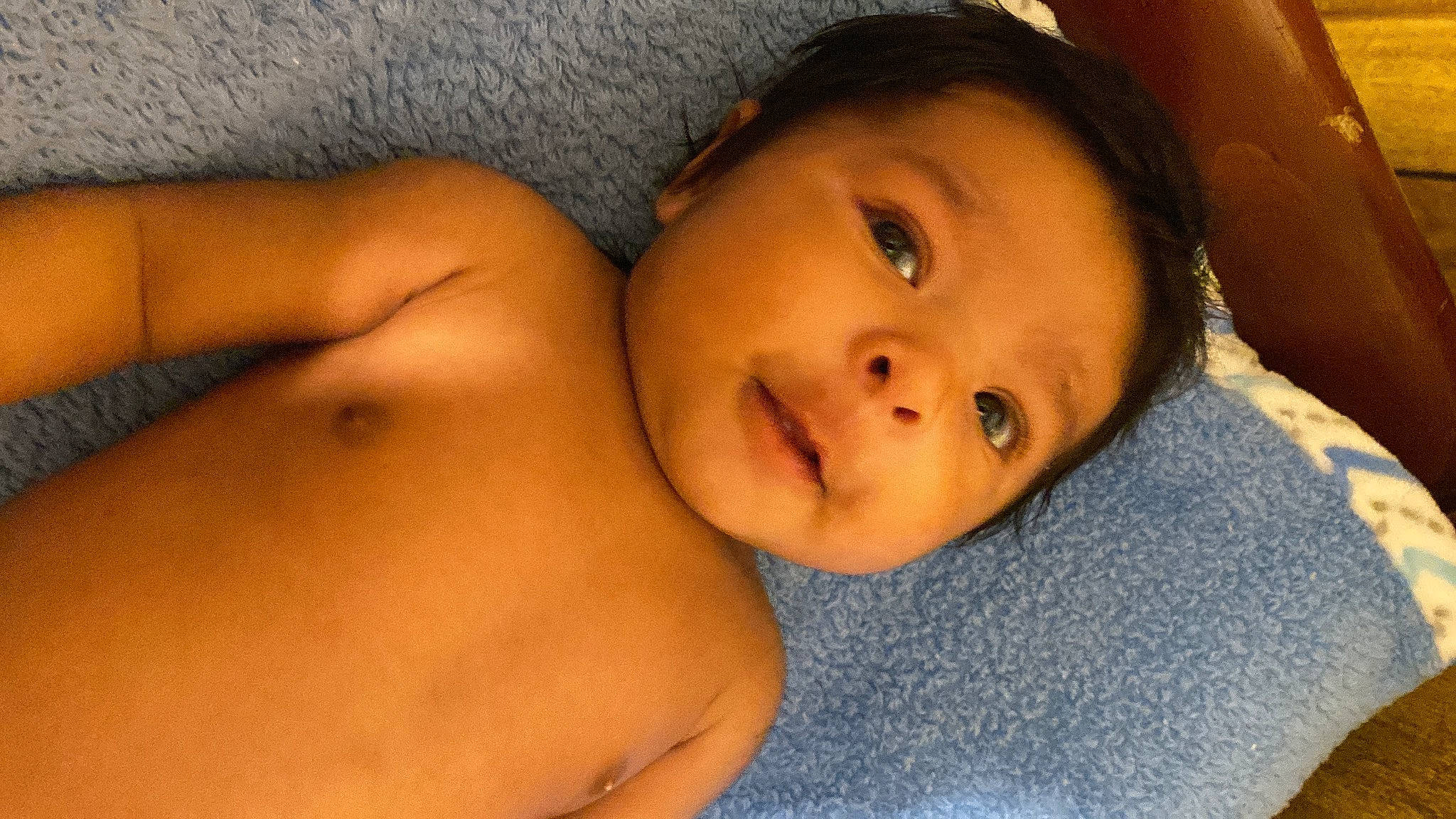 Angel is registered to the contest to win money with this photo: baby, black_hair, cheek, chest, chin, eye, eyebrow, eyelash, facial_expression, finger, forehead, iris, lip, mouth, neck, nose, person, skin, stomach, toddler