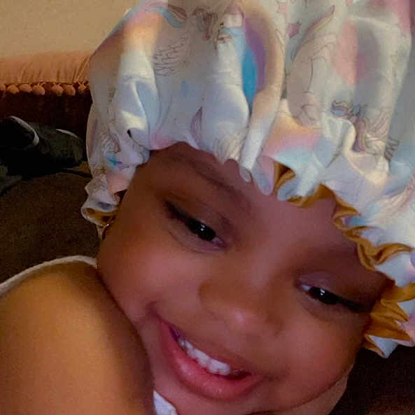 Katelyn joined the competition — help win amazing prizes! baby, baby_toddler_clothing, cap, costume_hat, eyebrow, eyelash, fashion_accessory, fun, hair_accessory, happy, hat, headband, headgear, headpiece, iris, magenta, petal, pink, smile, toddler
