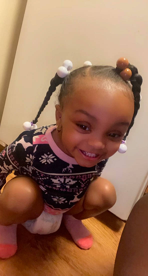 Katelyn is registered to the contest to win money with this photo: arm, audio_equipment, baby_toddler_clothing, cheek, child, ear, eye, eyebrow, eyelash, finger, flooring, happy, human_body, joy, leg, neck, person, skin, sleeve, smile