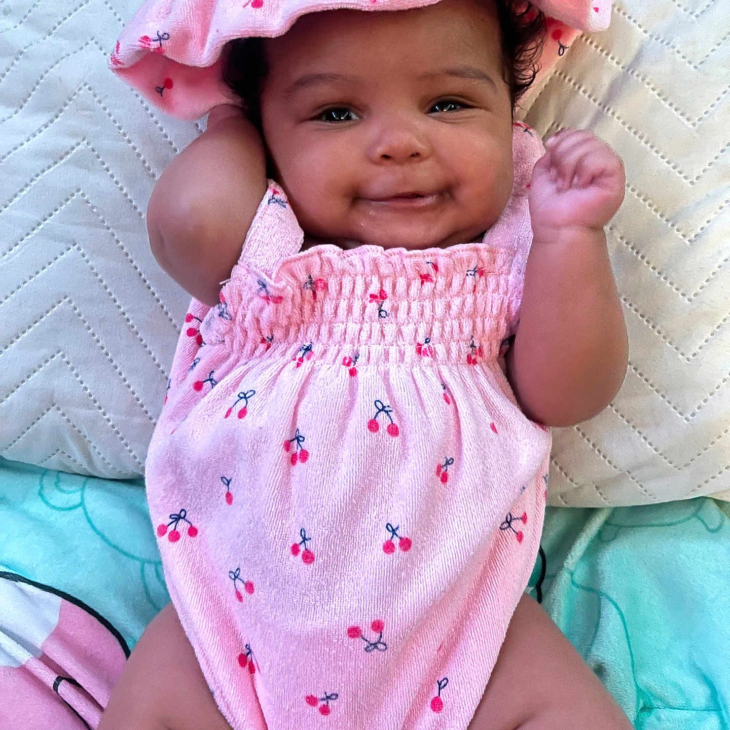 Valeria is registered to the contest to win money with this photo: baby, babylaughing, blanket, bonnet, cap, clothing, cushion, dress, face, happy, hat, head, homedecor, newborn, person, photography, portrait, sitting, smile, sunhat