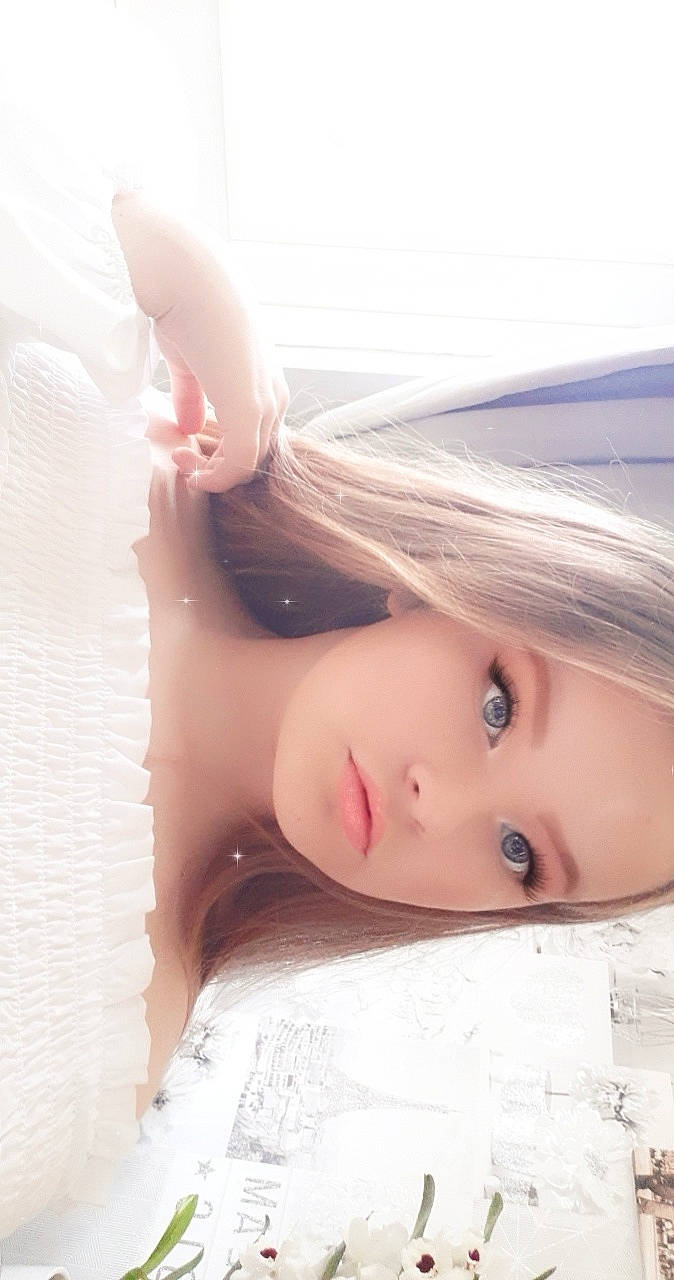 Chelsea joined the competition — help win amazing prizes! bangs, bridal_accessory, brown_hair, doll, dress, eyebrow, eyelash, fashion_design, fawn, hair_accessory, headgear, headpiece, iris, lip, long_hair, person, shoulder, skin, toy, wig