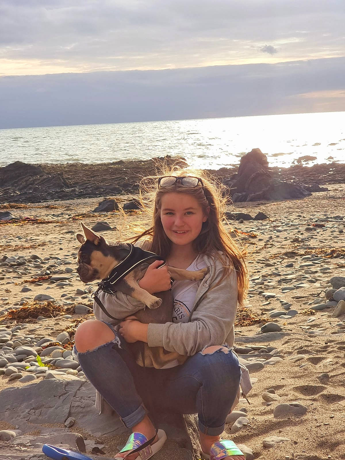 Chelsea is registered to the contest to win money with this photo: beach, carnivore, cloud, dog, fawn, fun, happy, joy, leg, leisure, mammal, musical_instrument, people_in_nature, person, shoe, sky, smile, sunlight, travel, vertebrate