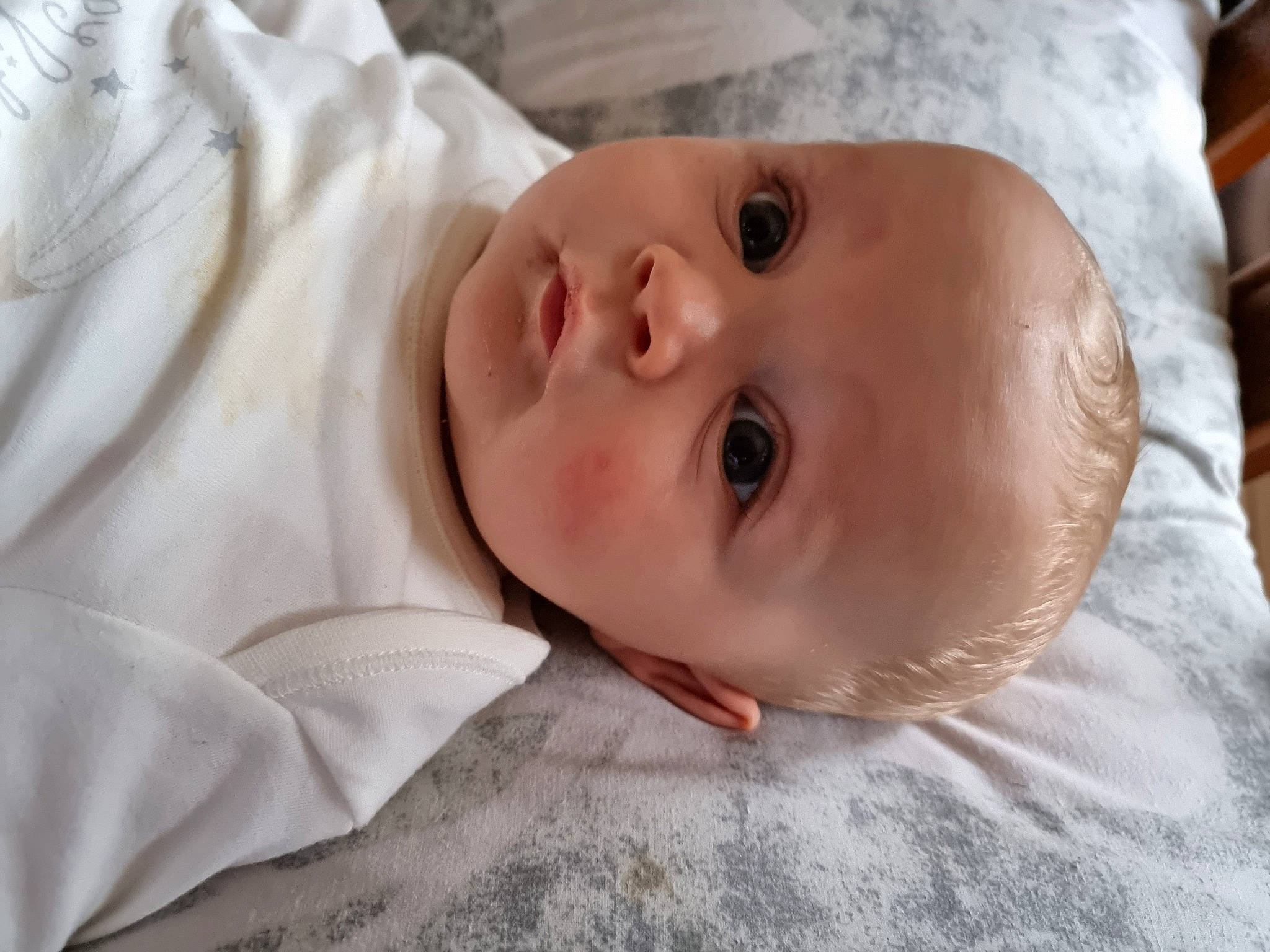 Harvey is registered to the contest to win money with this photo: baby, baby_toddler_clothing, cheek, child, comfort, eyebrow, eyelash, flooring, fur, happy, iris, linens, lip, nose, person, portrait_photography, room, sleeve, smile, toddler