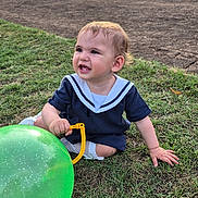 Sofia joined the competition — help win amazing prizes! baby, balloon, casual, child, cute, event, fun, grass, green_balloon, happy, nature, outdoor, person, playful, sailor_outfit, smiling, summer, sunlight, toddler, young_child