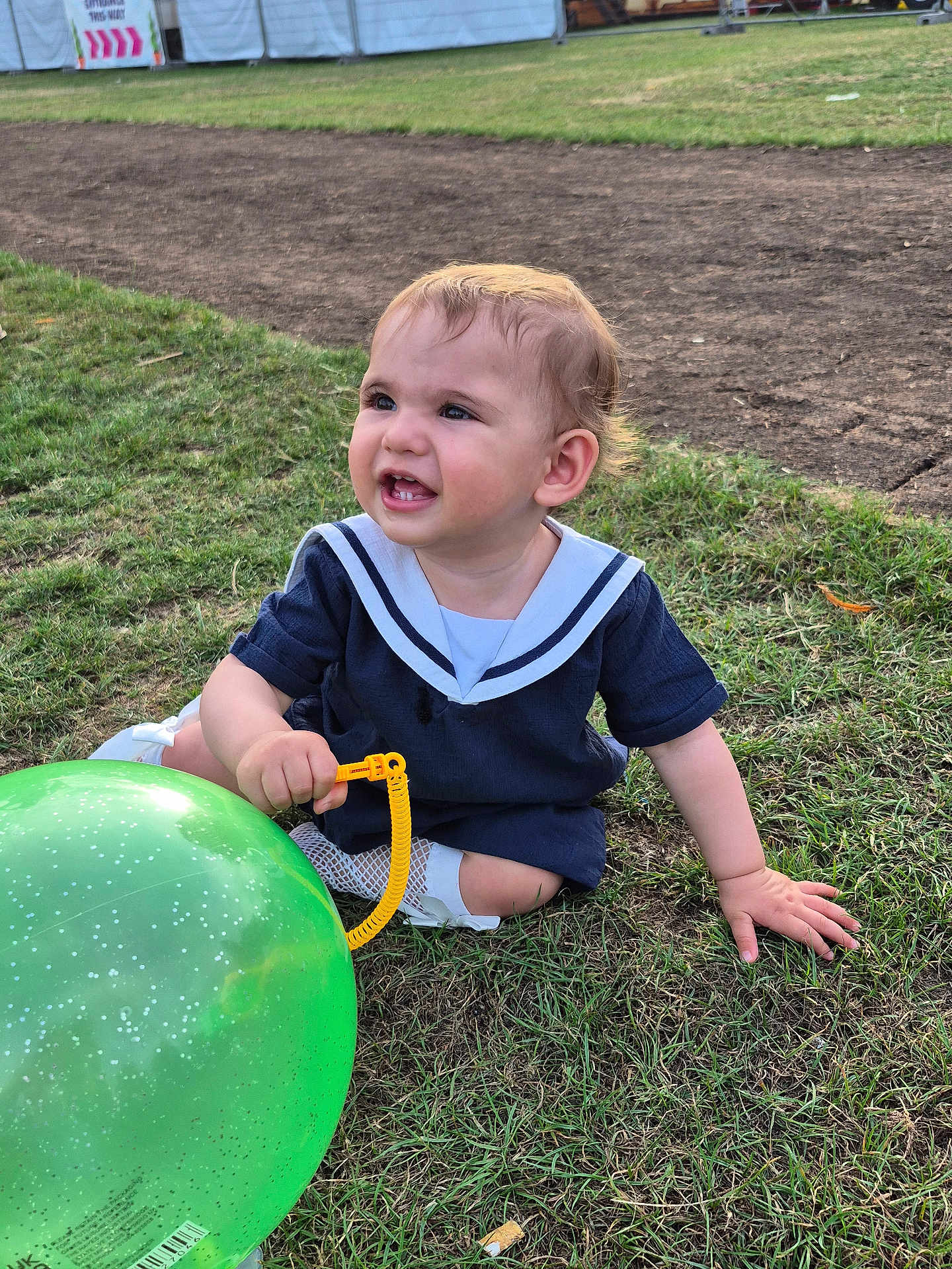 Sofia joined the competition — help win amazing prizes! baby, balloon, casual, child, cute, event, fun, grass, green_balloon, happy, nature, outdoor, person, playful, sailor_outfit, smiling, summer, sunlight, toddler, young_child