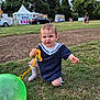 Sofia joined the competition — help win amazing prizes! balloon, car, child, clothing, daytime, grass, green_balloon, happy, kneeling, nature, outdoor, park, people, person, play, sailor_outfit, smile, toddler, toy, trees