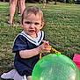 Sofia is registered to the contest to win money with this photo: balloon, child, cute, daylight, dress, footwear, fun, grass, green, nature, outdoor, park, people, person, playing, socks, summer, toddler, toy, yellow