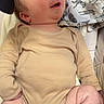 Léonel participe au concours pour gagner de l'argent avec cette photo : arm, baby, blanket, child, chubby, comfortable, cozy, cute, face, head, indoors, infant, leg, lying_down, newborn, onesie, person, skin, smiling, soft_fabric