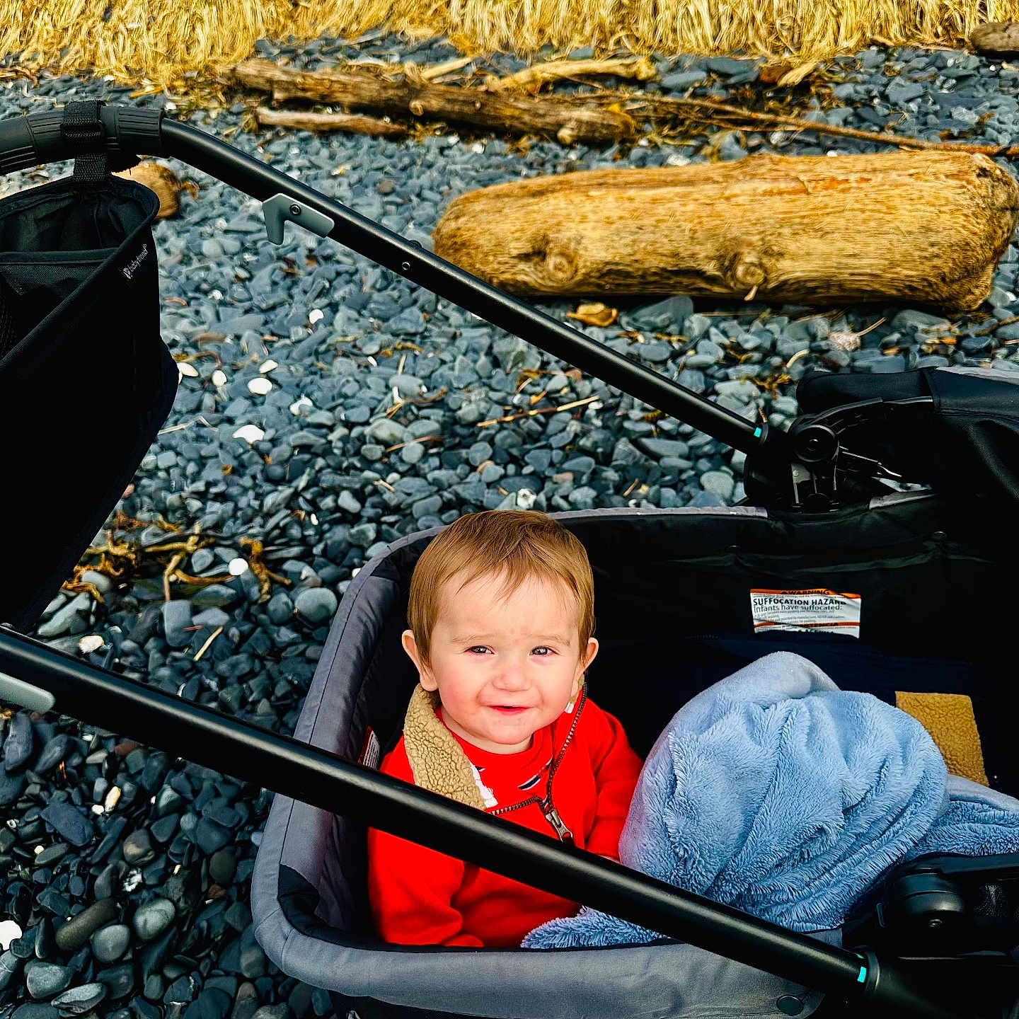 Yngvi joined the competition — help win amazing prizes! baby, clothing, face, gravel, gun, head, nature, outdoors, pants, pebble, person, photography, portrait, road, rock, soil, transportation, vehicle, weapon, wood
