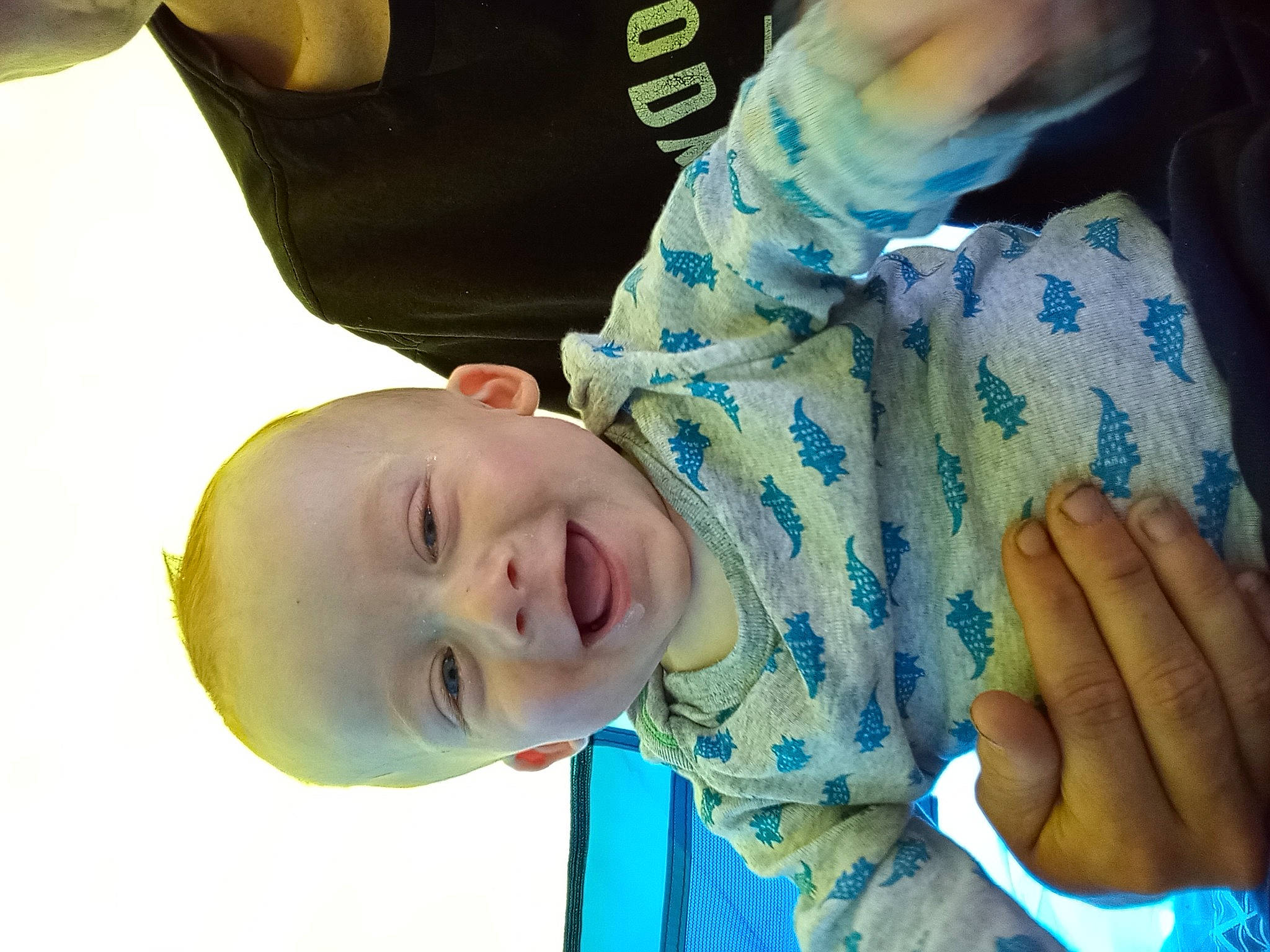 Ralphie is registered to the contest to win money with this photo: baby, child, elbow, finger, fun, gesture, happy, laugh, leisure, mouth, nail, nose, person, plant, play, sleeve, smile, t_shirt, thumb, toddler