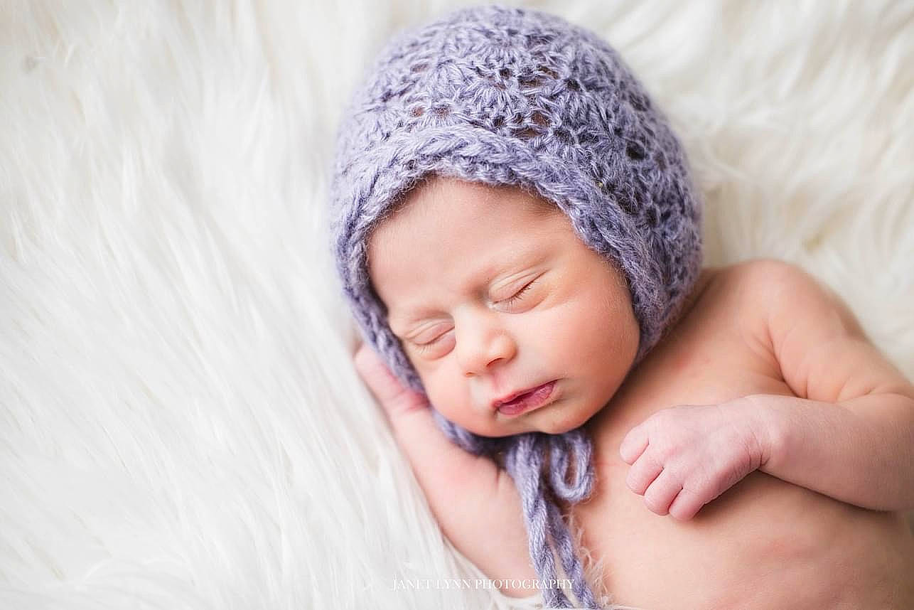 Lila is registered to the contest to win money with this photo: baby, baby_sleeping, baby_toddler_clothing, cap, child, comfort, eye, face, finger, gesture, hand, happy, head, headwear, human_body, knit_cap, linens, nail, person, skin